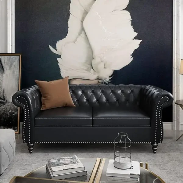 Loveseat with tufted design, rolled arms, and nail head trim